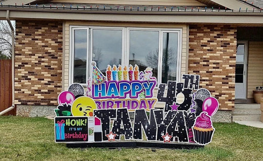 A yard card greeting in front of someone's home that reads "Happy 40th Birthday Tanya" and "Honk! It's my birthday".